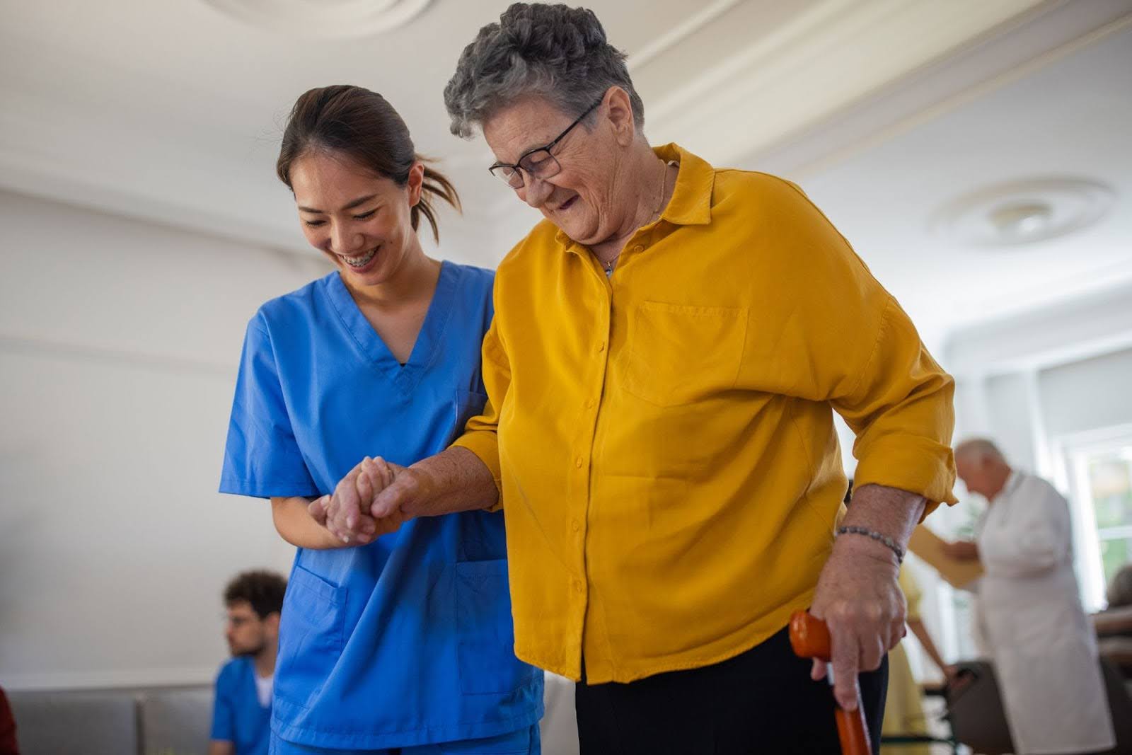 senior woman doing physical therapy with a skilled nurse